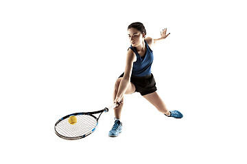 Image showing Full length portrait of young woman playing tennis isolated on white background