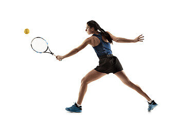 Image showing Full length portrait of young woman playing tennis isolated on white background