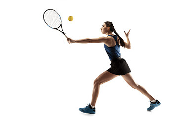 Image showing Full length portrait of young woman playing tennis isolated on white background