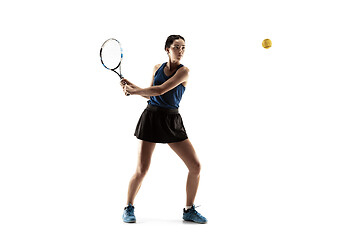 Image showing Full length portrait of young woman playing tennis isolated on white background