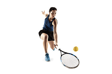 Image showing Full length portrait of young woman playing tennis isolated on white background