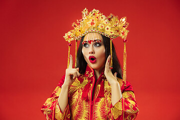 Image showing Chinese traditional woman. Beautiful young girl wearing in national costume