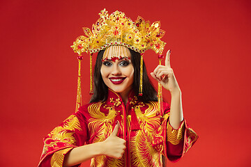 Image showing Chinese traditional woman. Beautiful young girl wearing in national costume