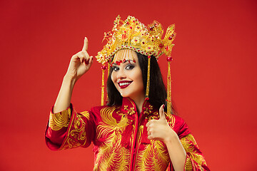 Image showing Chinese traditional woman. Beautiful young girl wearing in national costume