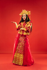 Image showing Chinese traditional woman. Beautiful young girl wearing in national costume