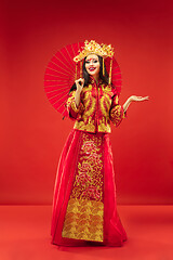 Image showing Chinese traditional woman. Beautiful young girl wearing in national costume