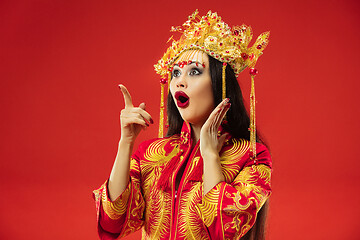 Image showing Chinese traditional woman. Beautiful young girl wearing in national costume