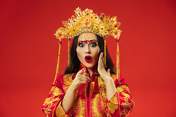 Image showing Chinese traditional woman. Beautiful young girl wearing in national costume