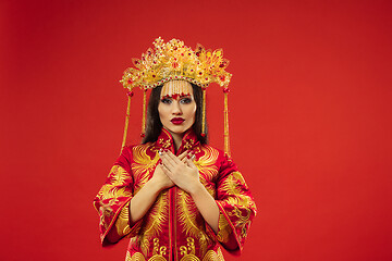 Image showing Chinese traditional woman. Beautiful young girl wearing in national costume