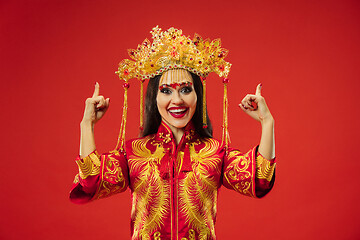 Image showing Chinese traditional woman. Beautiful young girl wearing in national costume