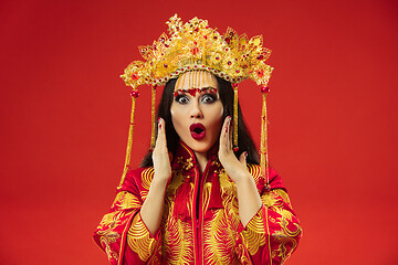 Image showing Chinese traditional woman. Beautiful young girl wearing in national costume