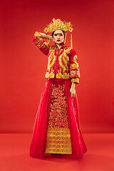 Image showing Chinese traditional woman. Beautiful young girl wearing in national costume