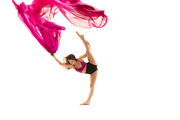 Image showing Ballerina. Young graceful female ballet dancer dancing over white studio. Beauty of classic ballet.