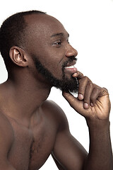 Image showing Close up portrait of a young naked african man indoors