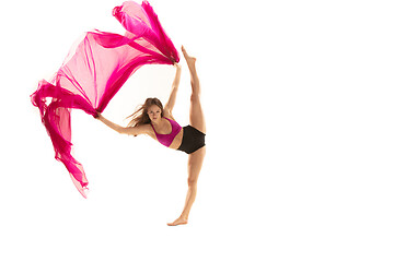 Image showing Ballerina. Young graceful female ballet dancer dancing over white studio. Beauty of classic ballet.