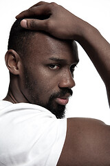 Image showing Close up portrait of a young african man indoors