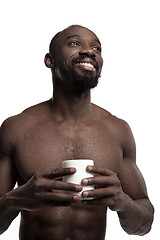 Image showing African man with cup of tea, isolated on white background