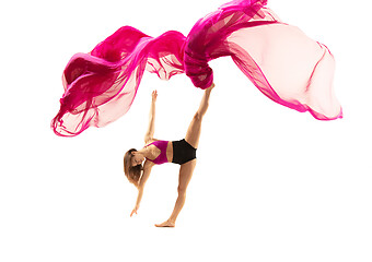 Image showing Ballerina. Young graceful female ballet dancer dancing over white studio. Beauty of classic ballet.