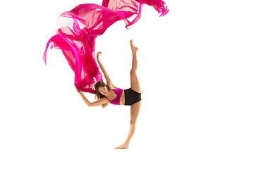 Image showing Ballerina. Young graceful female ballet dancer dancing over white studio. Beauty of classic ballet.