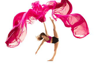 Image showing Ballerina. Young graceful female ballet dancer dancing over white studio. Beauty of classic ballet.