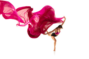 Image showing Ballerina. Young graceful female ballet dancer dancing over white studio. Beauty of classic ballet.