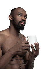 Image showing African man with cup of tea, isolated on white background