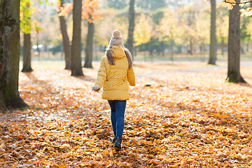 Image showing happy girl running in autumn park