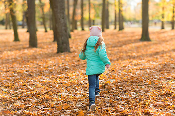 Image showing happy girl running in autumn park