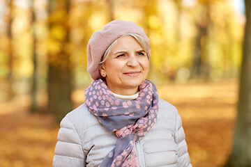 Image showing portrait of happy senior woman at autumn park