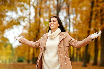 Image showing beautiful happy young woman in autumn park