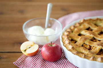 Image showing apple pie with ice cream on wooden table