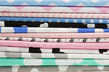 Image showing Stack of cotton fabric material background