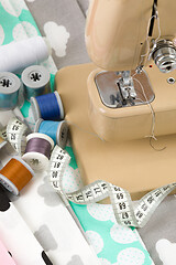 Image showing Sewing machine, fabric and measurement tape