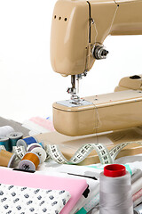 Image showing Sewing machine, fabric and measurement tape