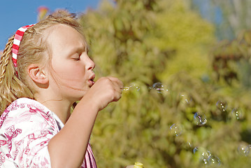 Image showing girl blowing bubbles
