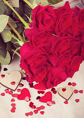 Image showing Small Valentine red hearts and fresh roses