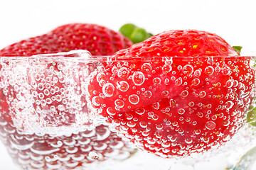 Image showing fresh strawberry in glass with sparkling water