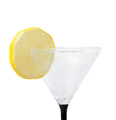 Image showing fresh lemon in glass with water drops