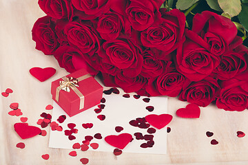 Image showing small Valentine gift and red roses