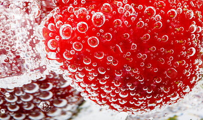 Image showing fresh strawberry in glass with sparkling water