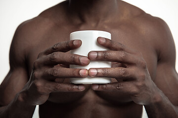 Image showing African man with cup of tea, isolated on white background