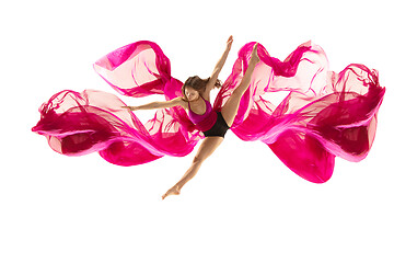 Image showing Ballerina. Young graceful female ballet dancer dancing over white studio. Beauty of classic ballet.