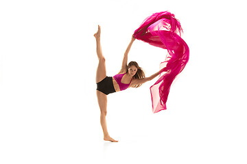 Image showing Ballerina. Young graceful female ballet dancer dancing over white studio. Beauty of classic ballet.