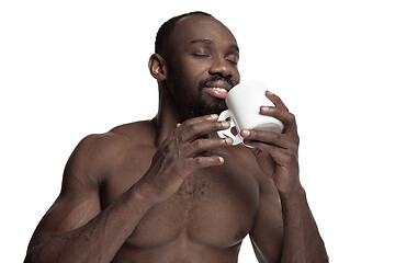 Image showing African man with cup of tea, isolated on white background