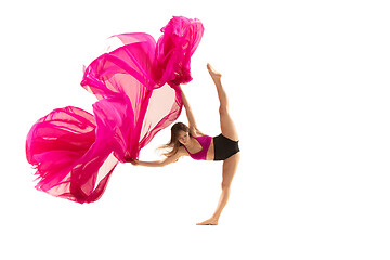 Image showing Ballerina. Young graceful female ballet dancer dancing over white studio. Beauty of classic ballet.