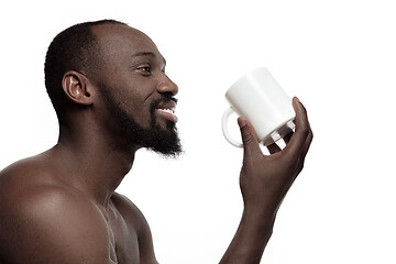 Image showing African man with cup of tea, isolated on white background