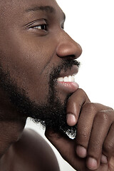 Image showing Close up portrait of a young naked african man indoors