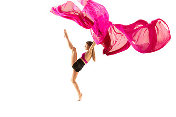 Image showing Ballerina. Young graceful female ballet dancer dancing over white studio. Beauty of classic ballet.