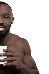 Image showing African man with cup of tea, isolated on white background