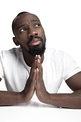 Image showing Close up portrait of a young african man indoors